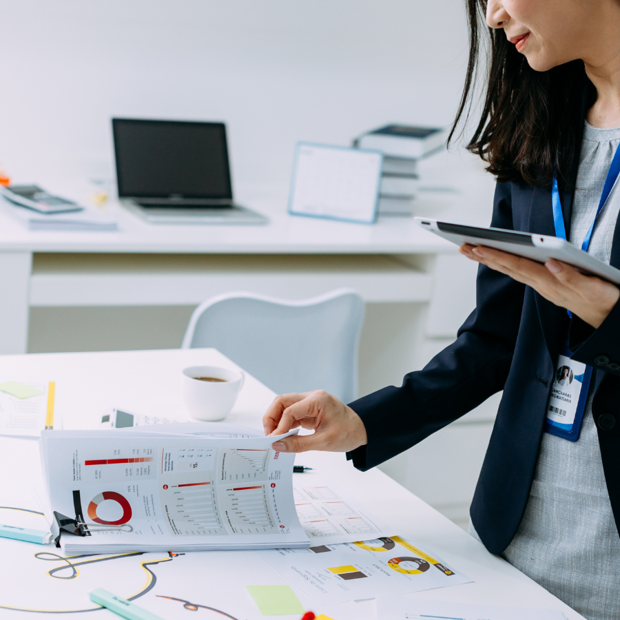closeup of Asian businesswoman checking financial data