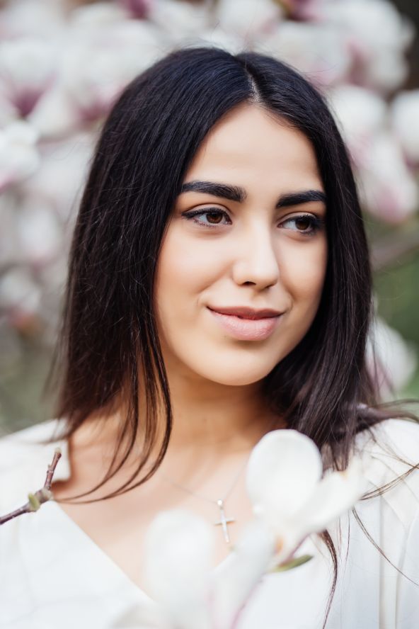 face-portrait-beautiful-caucasian-brunette-girl-near-blossom-magnolia-tree-outdoors-spring-park.jpg