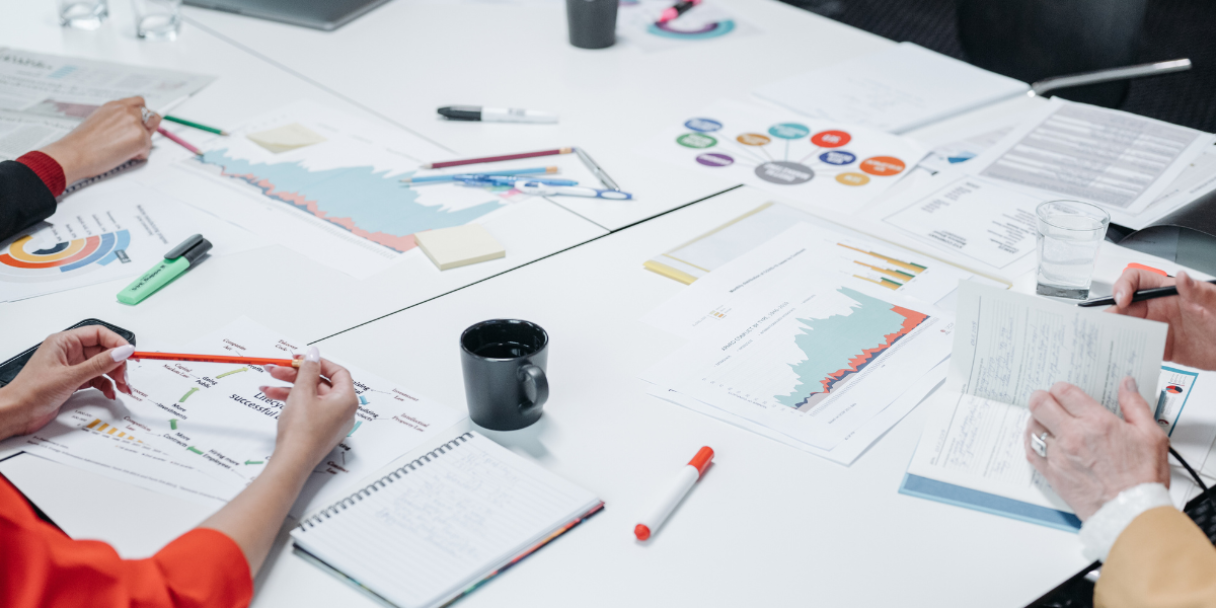 a closeup of a team discussing pricing data