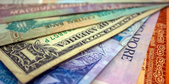 A closeup of various countries' currency notes overlapping