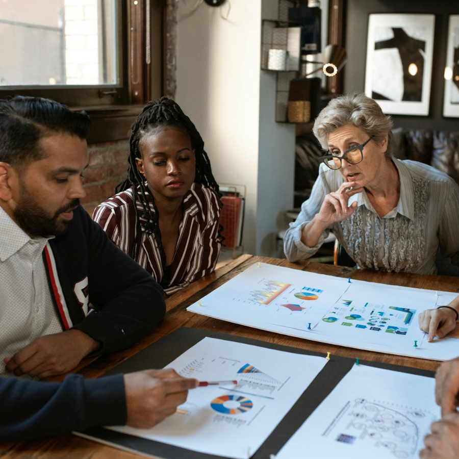 a diverse team analysing pay data