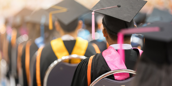 graduates in robes during a graduation ceremony