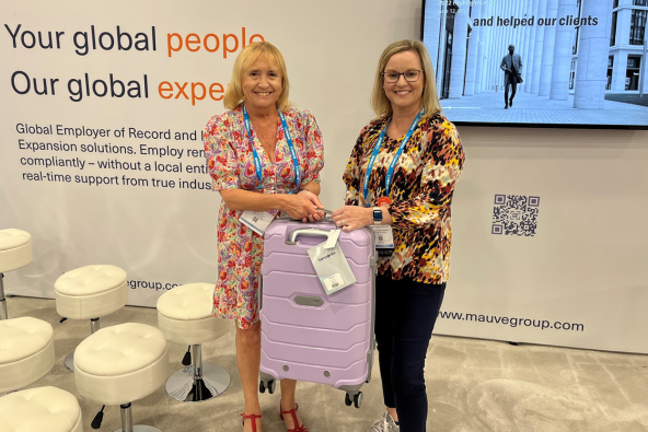 Mauve CEO Ann Ellis awarding the grand prize winner a mauve-coloured Samsonite luggage