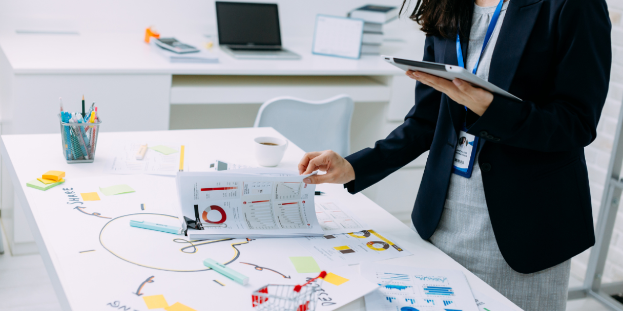 Businesswoman checking documents of financial data