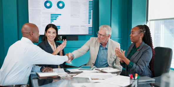 Diverse group of business people shaking hands