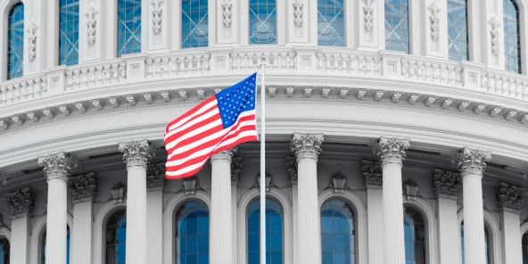 exterior of capitol hill with the US flag in view