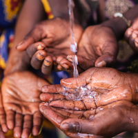 children's palms holding out to get water