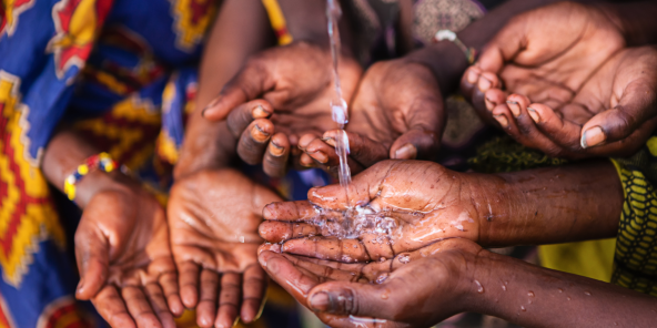 children's palms holding out to get water