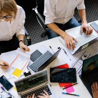 a team analysing documents of data