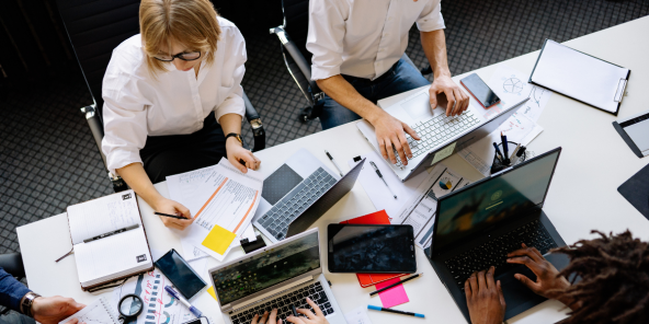 a team analysing documents of data