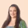 Grace Stoner Headshot with Peach Background