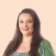 Grace Stoner Headshot with Peach Background