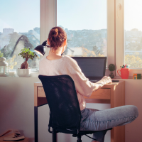 Remote worker working from her bedroom