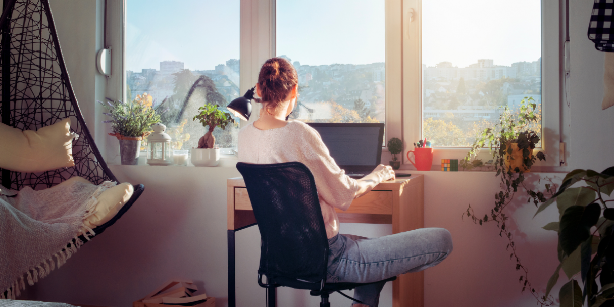 Remote worker working from her bedroom