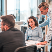 male middle-aged manager helping a colleague