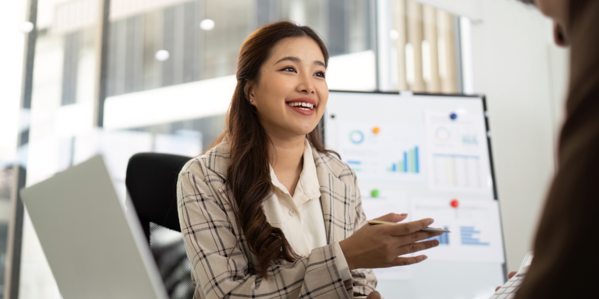 female asian accountant in discussion with a client