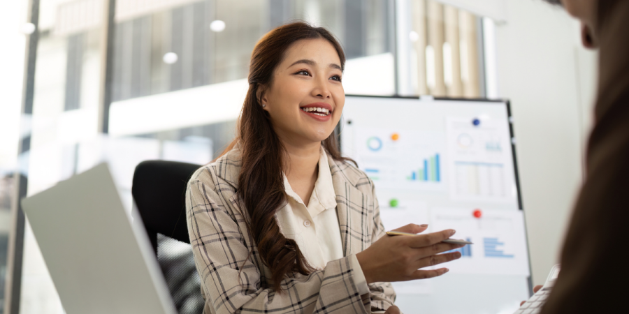 female asian accountant in discussion with a client