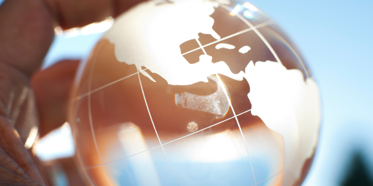 Closeup of a hand holding glass globe