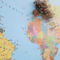 world map dotted with location pins