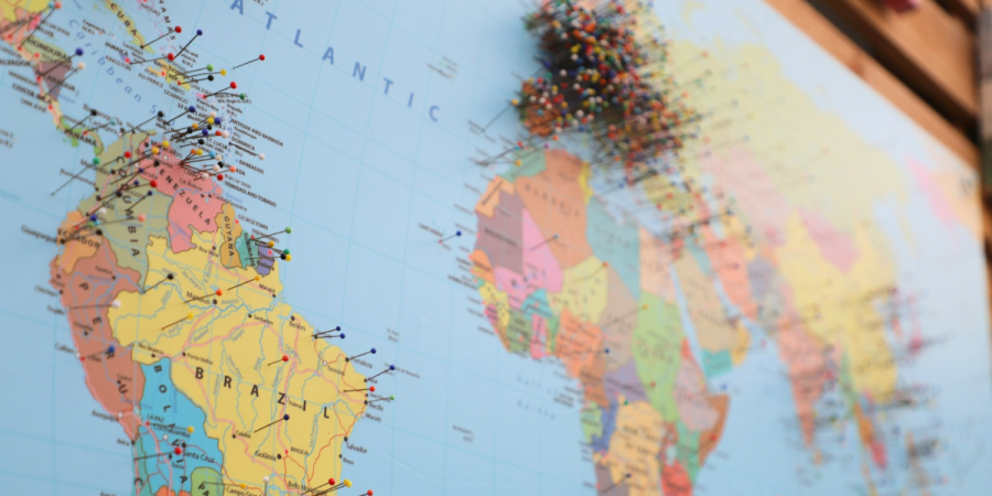 world map dotted with location pins