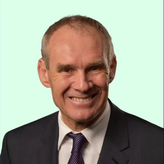 John Ellis Headshot with Light Green Background