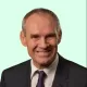 John Ellis Headshot with Light Green Background