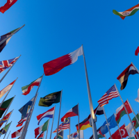 a collection of country flags against a blue sky