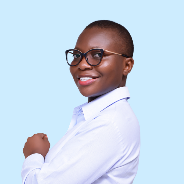 A woman wearing glasses and a white collared shirt smiles with arms crossed.