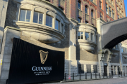 The Guinness Storehouse entrance with the Guinness logo and St. James's Gate, Dublin, Ireland text on a black gate.