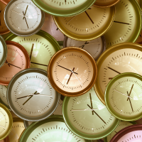 Overlapping coloured clock faces