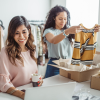 female small business owners packing orders