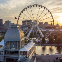 La Grande roue de Montreal Ferris Wheel during summer dusk in Quebec, Canada.