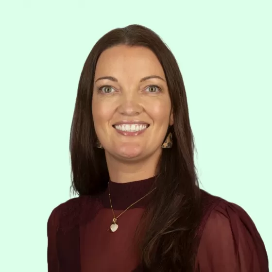 Annette Ord Headshot with Light Green Background
