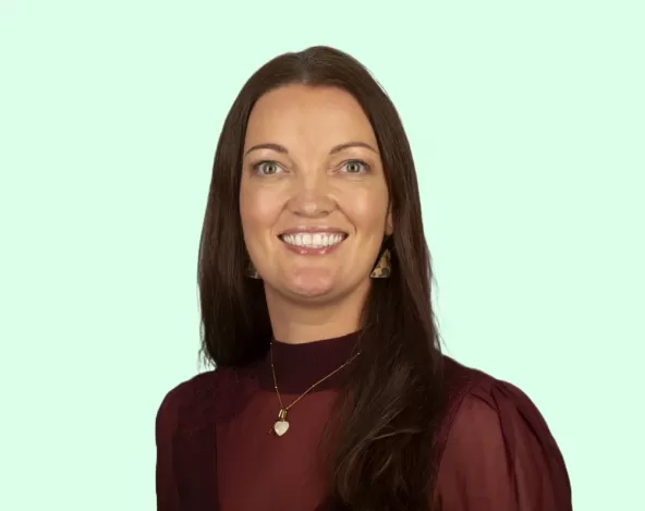 Annette Ord Headshot with Light Green Background