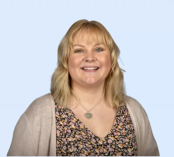 Abi Streeton Headshot with Blue Background