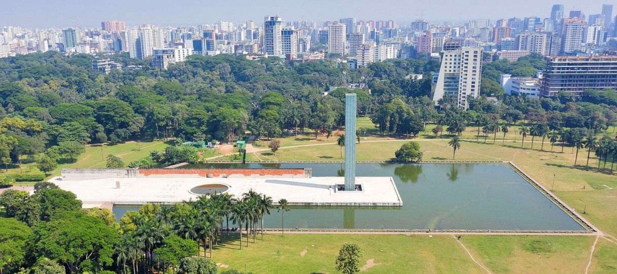 Aerial view of Dhaka skyline, including the Independence Monument in Suhrawardy Udyan and the adjacent Ramna Park