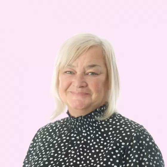 Karen Lilley headshot with Pink Background