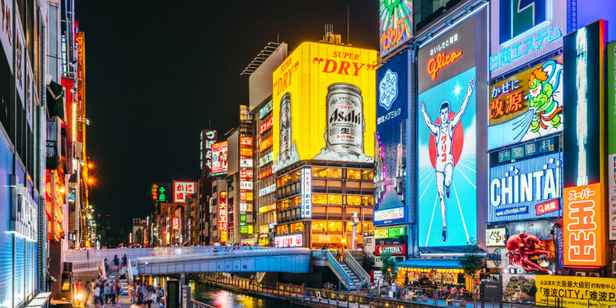 Lit up advertisements lining Dotonbori Canal in Osaka, Japan