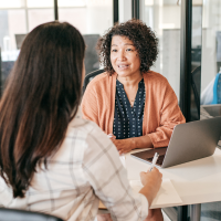 Two female colleagues in discussion in the office
