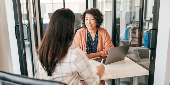 Two female colleagues in discussion in the office