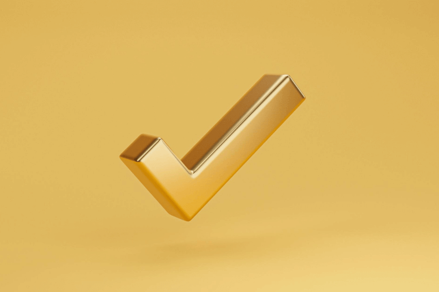 A golden tick mark on a yellow background