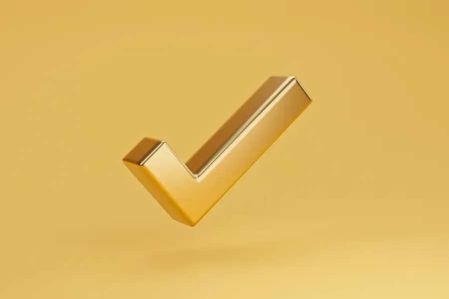 A golden tick mark on a yellow background