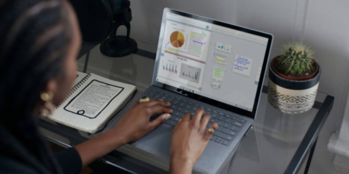 Female black remote working on a laptop