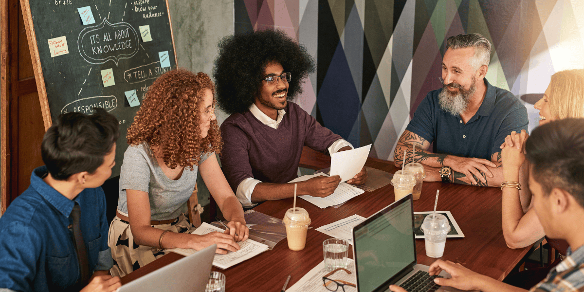 Group of work colleague have an informal meeting in a modern office