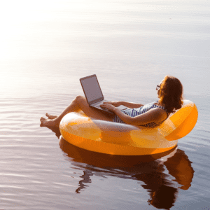 Woman on a Floatie working from her Laptop