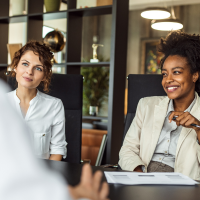 two businesswomen leading a meeting