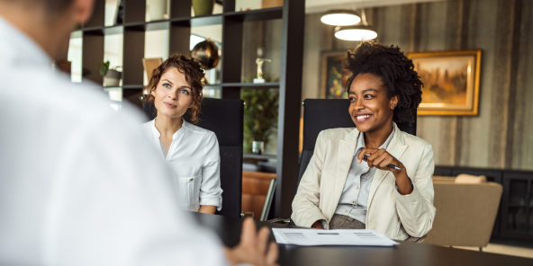 two businesswomen leading a meeting