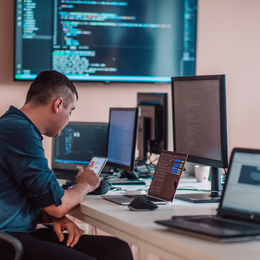 A programmer testing his app code